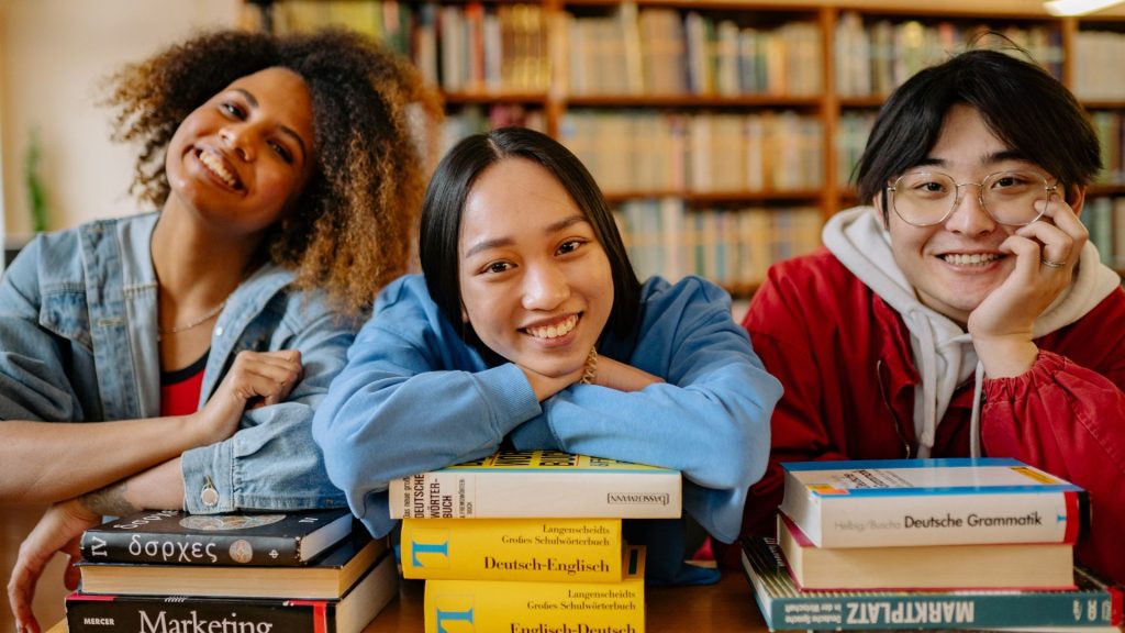 Three high school students sitting in on a summer program